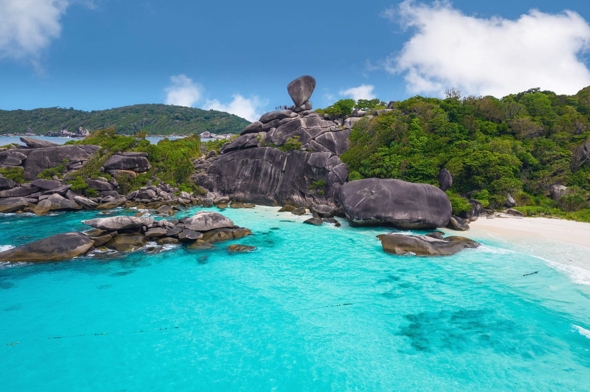 Aerial view of Donald Duck Bay and Sail Rock on Similan Island No. 8, with turquoise water and white sand